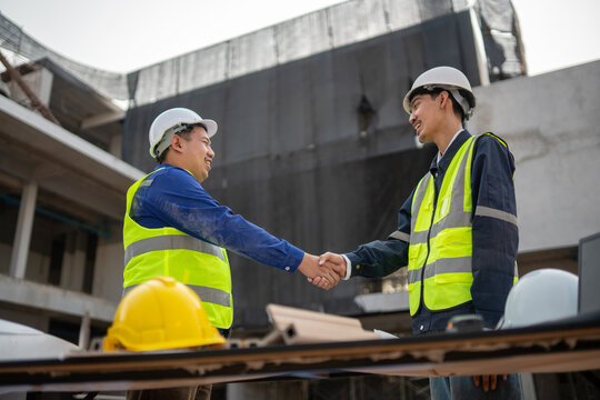 Construction collaboration meeting job site professional interaction urban environment close-up teamwork and partnership