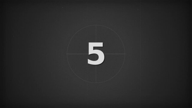 A vintage countdown timer display against a dark, textured background