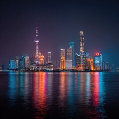 Obraz premium Vibrant city skyline at night, illuminated by bright colorful lights