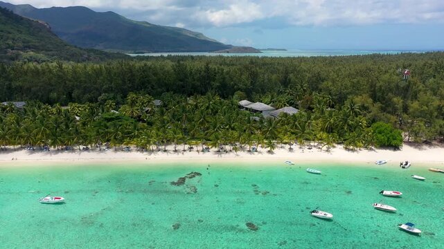 Tropical scenery, beautiful beaches of Mauritius island, Le Morne, popular luxury resort. Le Morne beach luxury resorts, Mauritius. Luxury beach in Mauritius, sandy beach with palms and blue ocean.