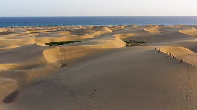 Landscape with Maspalomas town and golden sand dunes, Gran Canaria, Canary Islands, Spain. Natural Reserve of Dunes of Maspalomas, in Gran Canaria, Canary Islands, Spain.