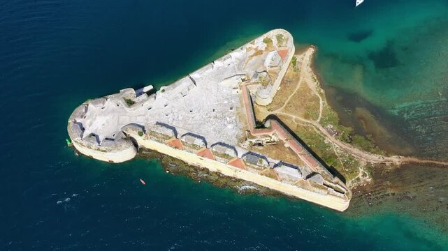 Aerial shot of St. Nicholas Fortress near Sibenik in Croatia. Old St. Nicholas fortress at Sibenik bay entrance, Dalmatia, Croatia, drone aerial shot of beautiful blue coastline seascape