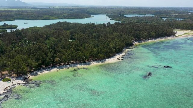 Ile aux Cerfs island with idyllic beach scene, aquamarine sea and soft sand, Ile aux Cerfs, Mauritius, Indian Ocean, Africa. Ile aux Cerf in Mauritius, beautiful water and breathtaking landscape.