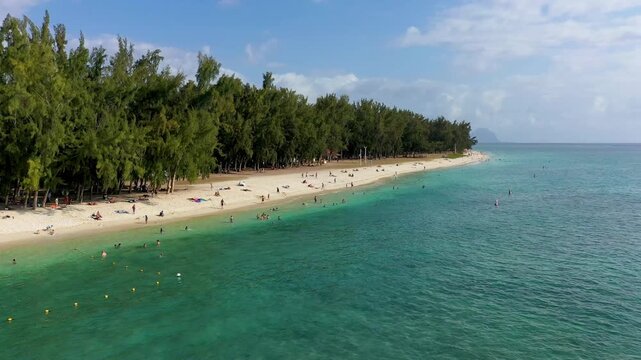 Beautiful Mauritius island with beach Flic en flac. Coral reef around tropical palm beach, Flic en Flac, Mauritius. Aerial view of a beautiful beach along the coast in Flic en Flac, Mauritius.