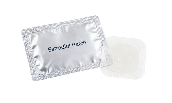 Transdermal estradiol patch isolated on white background, contraception and hormone therapy concept 
