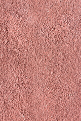 Fototapeta premium Full frame background of a dusty rose and muted purple pastel textured wall with a grainy plaster surface and weathered artistic details. Background Pattern.