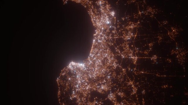 Algiers (Algeria) aerial view at night. Top view on modern city with street lights. Camera is zooming out, rotating clockwise. Vertical video. The north is on the left side