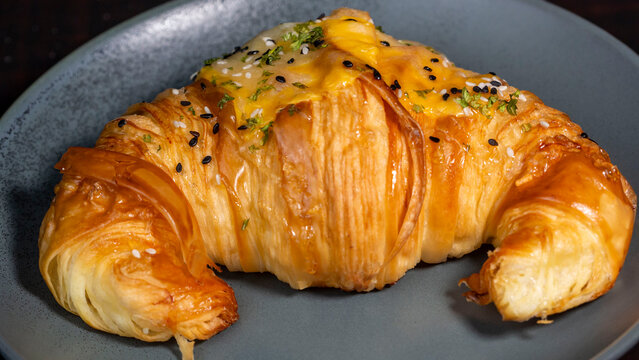 butter croisan with cream topping on plate