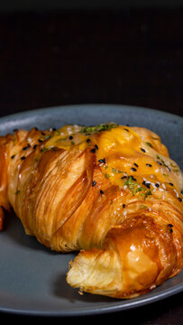 butter croisan with cream topping on plate