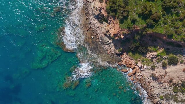 Top Down Aerial of Rugged Akamas Peninsula Cliffs and Turquoise Mediterranean Sea in Cyprus
