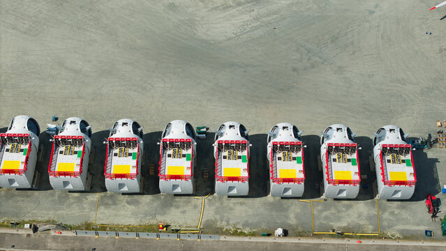 Aerial view of wind turbine nacelles lined up at the Siemens Gamesa Renewable Energy facility in Kingston upon Hull, England, United Kingdom.