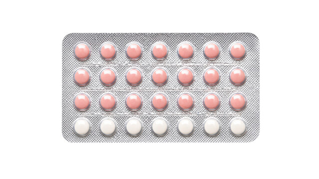 Blister pack of oral contraceptive pills with 28 tablets pink and white isolated on white background