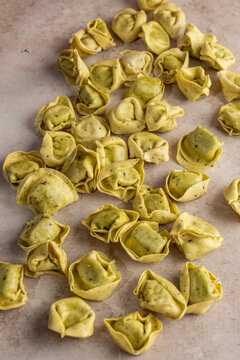 Fresh tortellini on a stone surface 