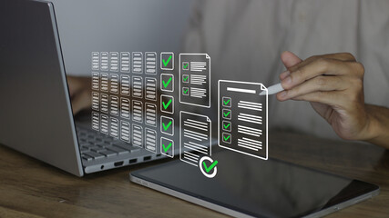 Fototapeta na wymiar Validating digital documents and checklists using a tablet and stylus for business compliance. This process ensures data accuracy through systematic electronic verification and quality control