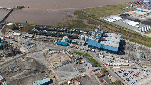 Aerial view of the Salt End Chemicals Park and power station featuring industrial infrastructure, cooling towers, and storage tanks near the Humber estuary Salt End, England, United Kingdom.