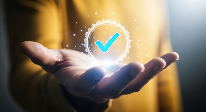 A person holds a glowing blue checkmark in their hand with a yellow shirt