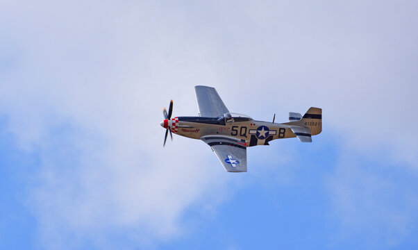 Vintage  North American P-51D Mustang fighter aircraft in flight
