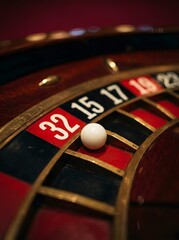 Obraz premium Close Up of White Ball Landing on Number Fifteen on a Luxury Wooden Roulette Wheel in Casino