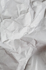 Obraz premium Close-up light kraft paper texture with visible wrinkles and recycled fibers, clean neutral background for mockups, branding, packaging and eco design concepts