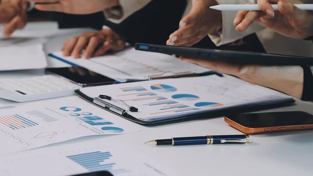 Anonymous hands of an accountant working with documents