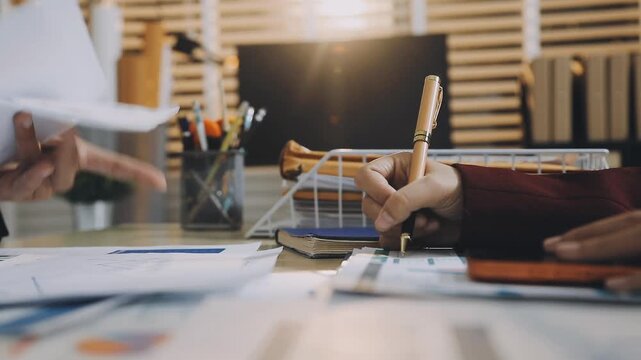 Anonymous hands of an accountant working with documents