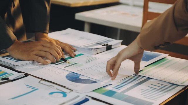 Anonymous hands of an accountant working with documents