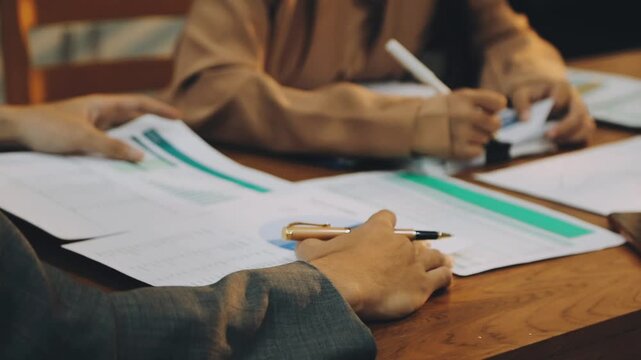 Anonymous hands of an accountant working with documents