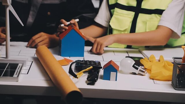 Construction and structure of Engineer or architect meeting for project working with partner and tools on model building and blueprint in working site