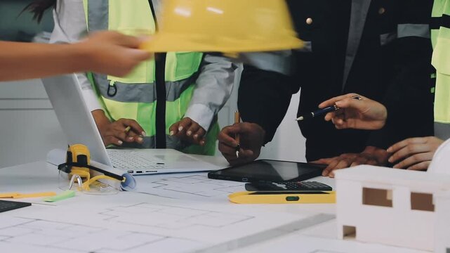Construction and structure of Engineer or architect meeting for project working with partner and tools on model building and blueprint in working site