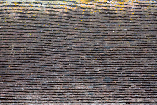 Background texture of old clay terracotta roof tiles for use as a background texture