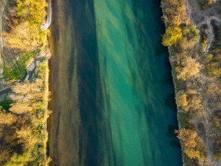 Naklejka premium Aerial view of Sava river passing under the highway bridge near the town of Zapresic, Croatia