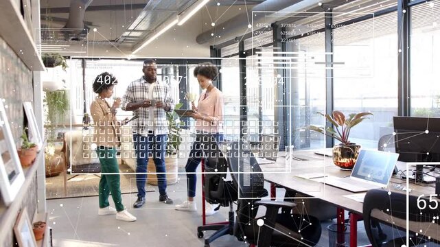 Team tapping tablet while camera panning, reviewing tech data with HUD overlay over group