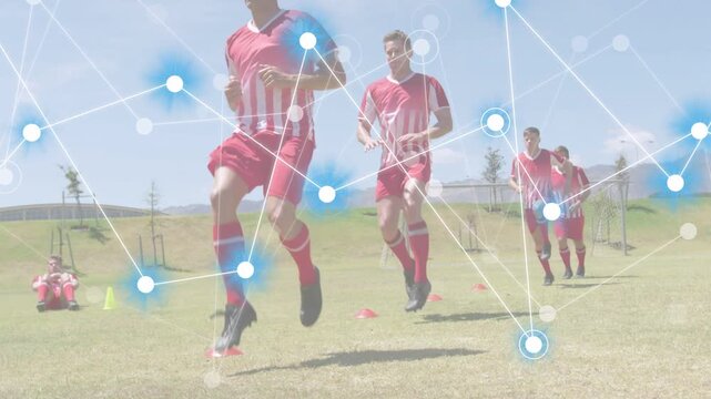 Lead player running on field following cones, lifting knee, training soccer while overlay tracking