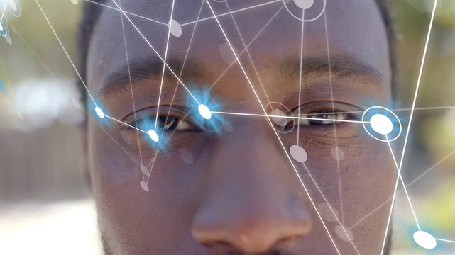 man opening eyes as network nodes slide from left, aligning near eyes for AR tracking