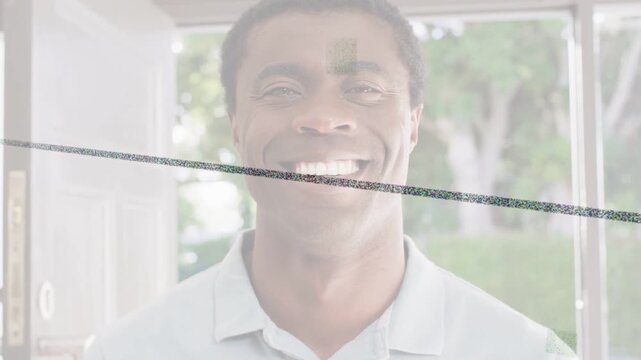 Man after camera cue, smiling gradually in doorway while overlays tracking face for marketing