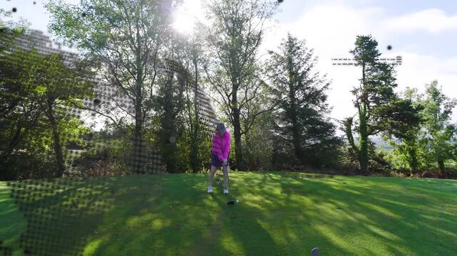 Senior golfer lining up, swinging club, hitting shot toward fairway, dotted overlay obscuring left