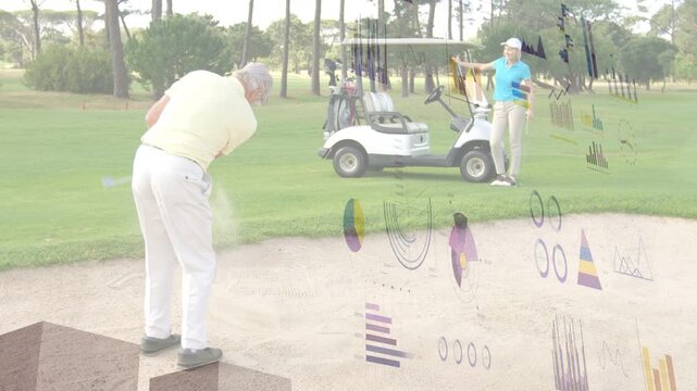 Senior man readying swinging club spraying bunker sand toward hole as she watching charts shifting