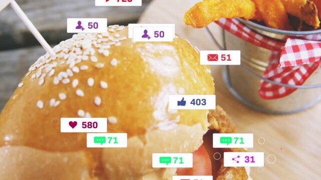 Stacked burger attracting social badges after alert ping, revealing fries while showing engagement