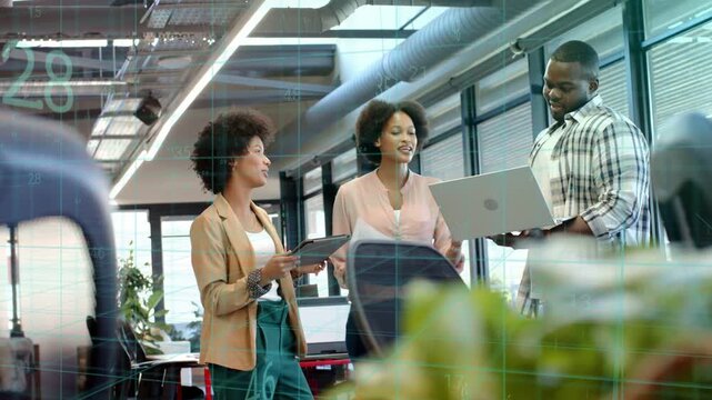 Three colleagues angling laptop and tapping tablet while pointing pages, confirming business plan