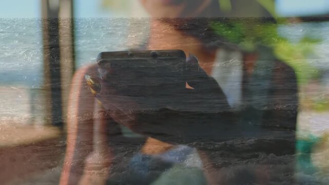 Woman raising smartphone by window, sea reflection overlay sweeping frame while testing mobile app