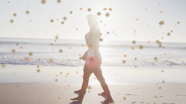 Couple walking shore sunset urging one moving behind hugging sparkle overlay on profiles for travel
