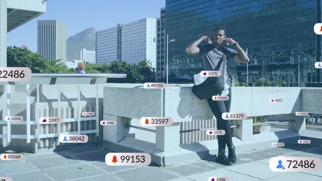Man leaning in plaza checking phone and donning headset with floating app notifications multiplying
