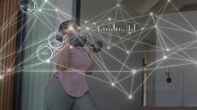 Woman at home holding weights bringing to rack pressing overhead with AR updating fitness metrics