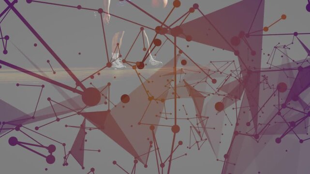 Basketball player entering frame dribbling ball while overlay nodes moving around him, sports demo