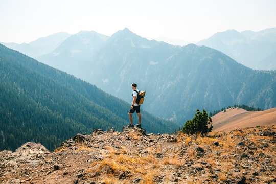 Hiker on mountain ridge near Mount Howard above Wallowa Lake, Oregon