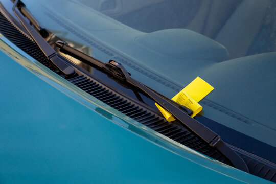 Oslo Parking Ticket Violation Fine Yellow Citation Under Windshield Wiper Traffic Enforcement Urban Regulation Vehicle Compliance Penalty Notice Parking Law Municipal Fine Road Safety
