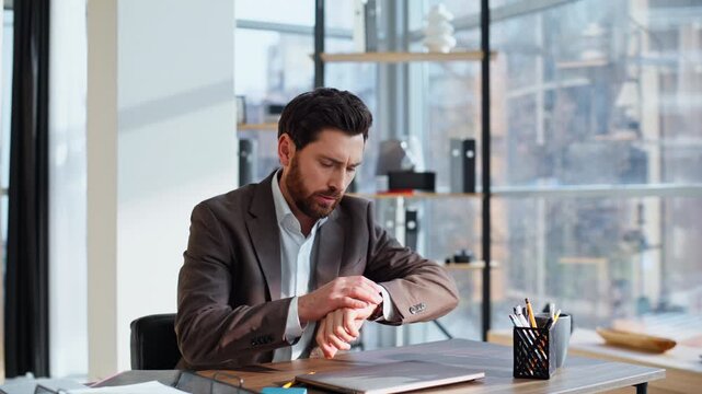 Rich investor looking watch stand up workplace hurrying business meeting closeup