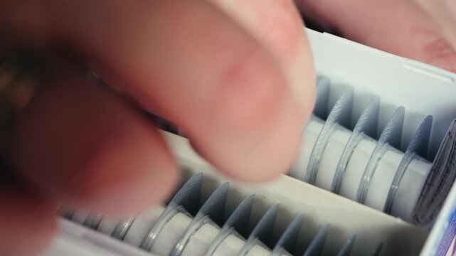 A woman takes a blister pack of pills to take them. Close up of blister pack of pills. High quality 4k footage