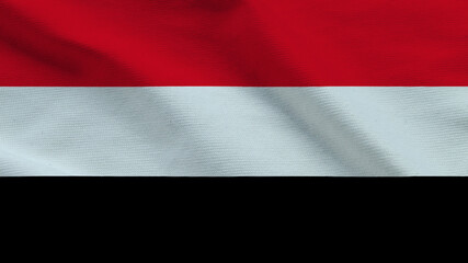 The flag of Yemen features bold horizontal stripes in red, white, and black, symbolizing the country's unity, struggle, and achievements. It stands proudly, showcasing national pride. © Valeri