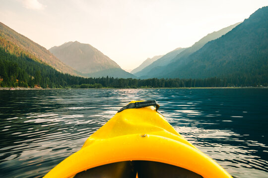Kayaking on Wallowa Lake surrounded by mountains in Oregon